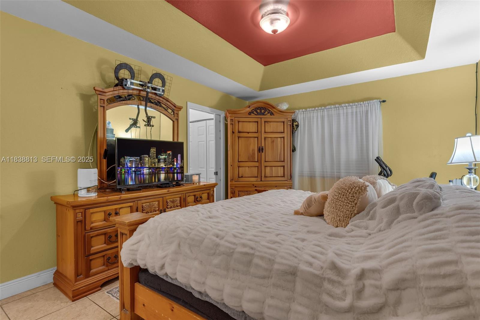 25237 Southwest 133rd Place Homestead, FL 33032 - Photo 22 of 39 a bedroom with a bed and a fireplace