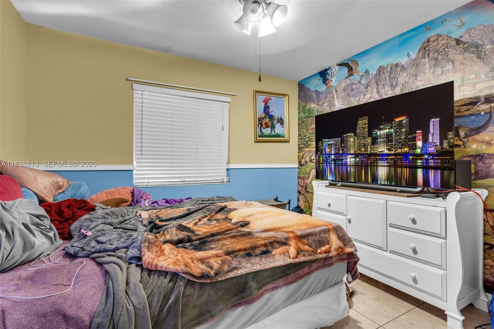 25237 Southwest 133rd Place Homestead, FL 33032 - Photo 28 of 39 a bedroom with bed and window