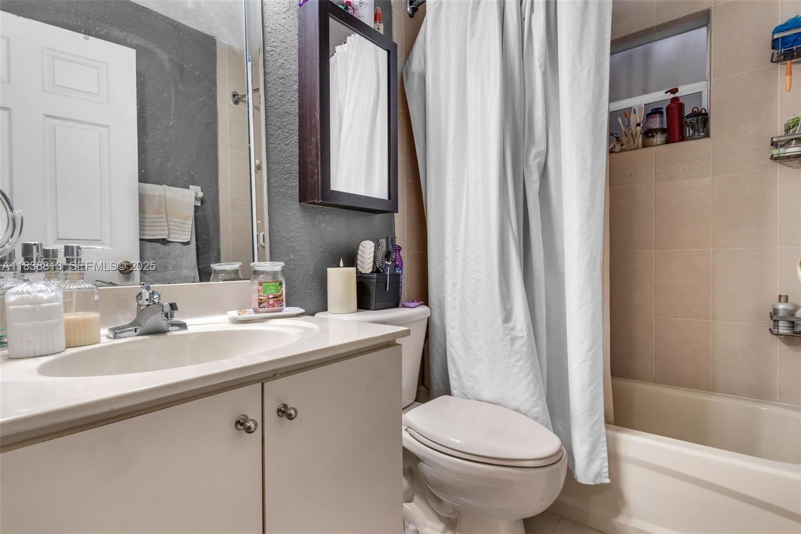 25237 Southwest 133rd Place Homestead, FL 33032 - Photo 30 of 39 a bathroom with a sink toilet and shower