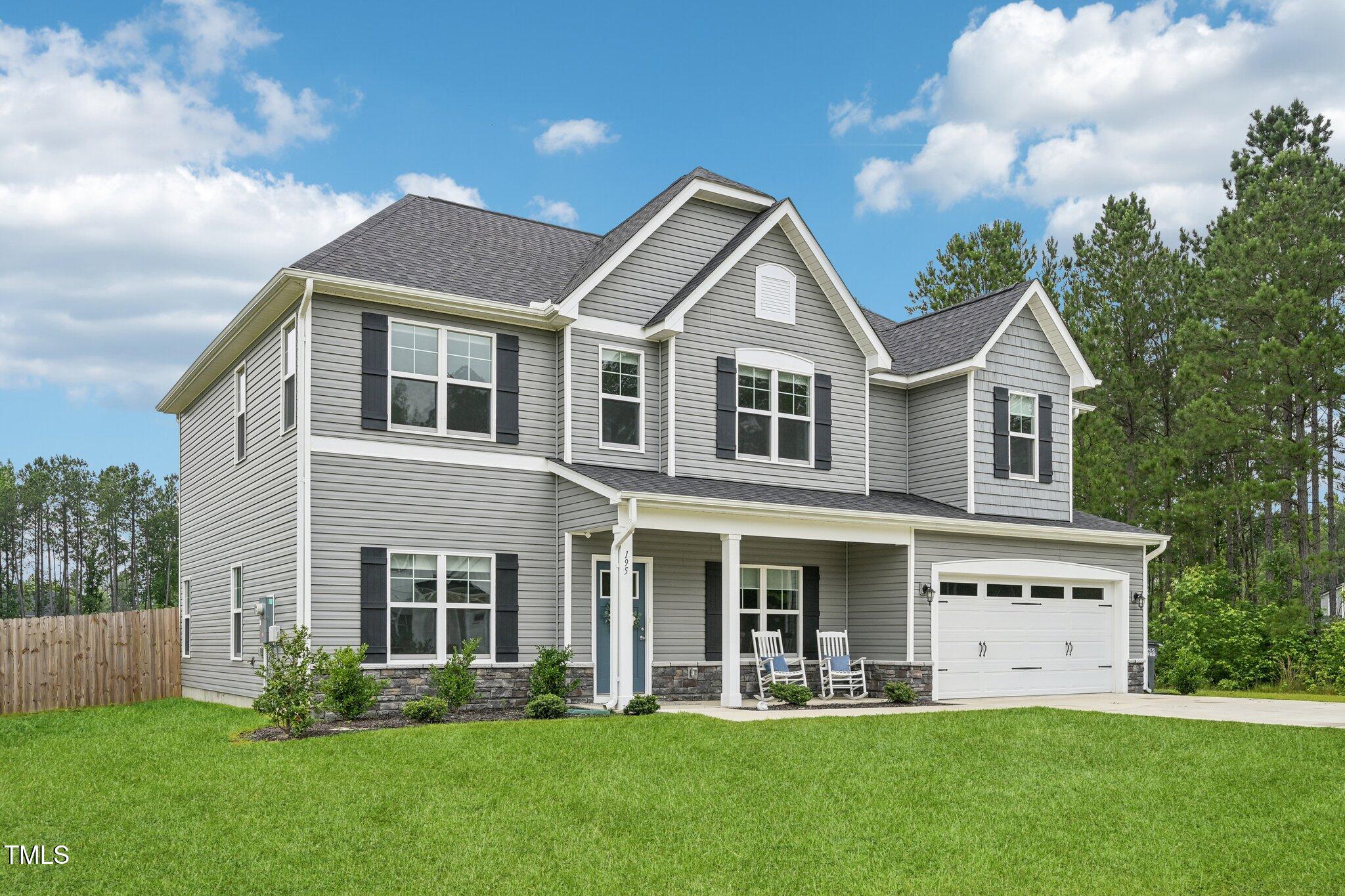 195 Solomon Drive Cameron, NC 28326 - Photo 1 of 46 a front view of a house with a yard and trees