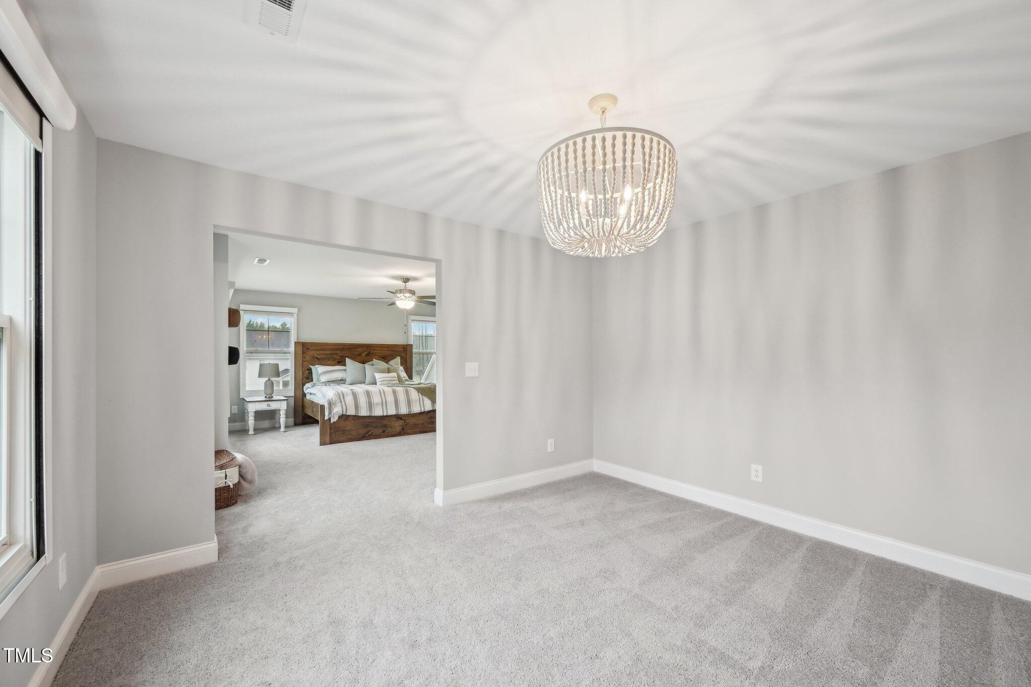 195 Solomon Drive Cameron, NC 28326 - Photo 27 of 46 a view of empty room with kitchen view