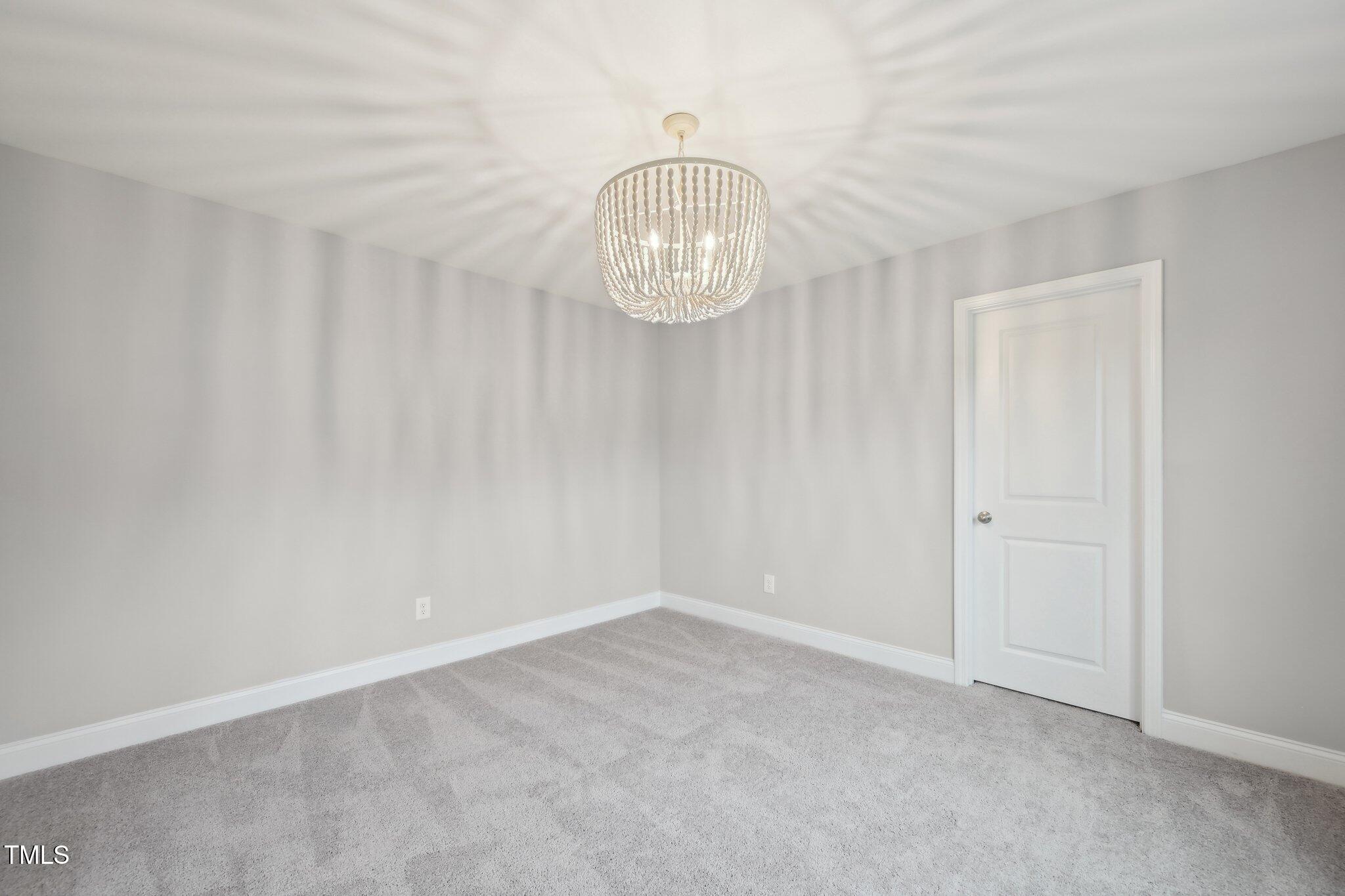 195 Solomon Drive Cameron, NC 28326 - Photo 28 of 46 a view of an empty room with wooden floor and a window