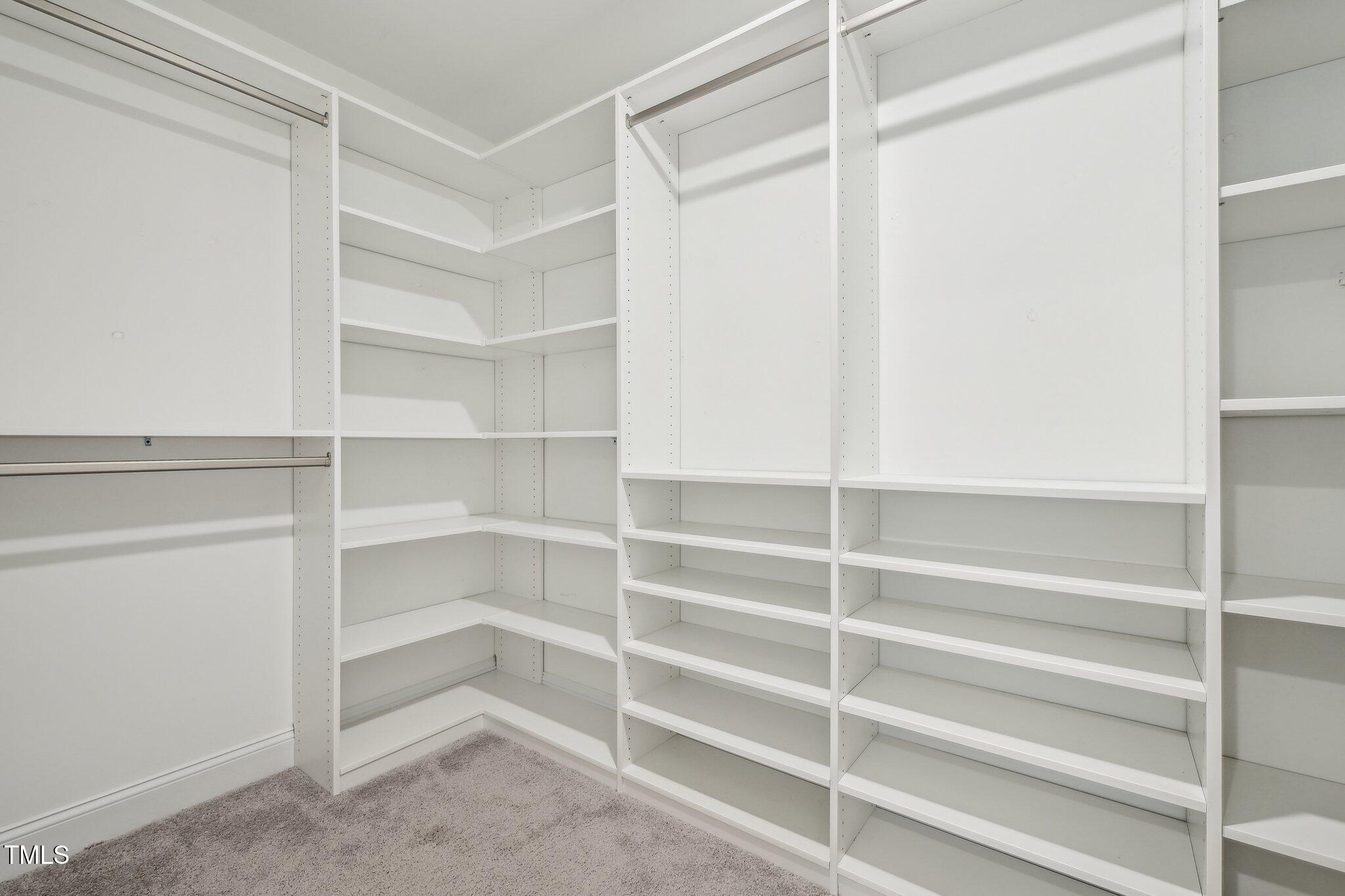 195 Solomon Drive Cameron, NC 28326 - Photo 31 of 46 a view of walk in closet with empty racks