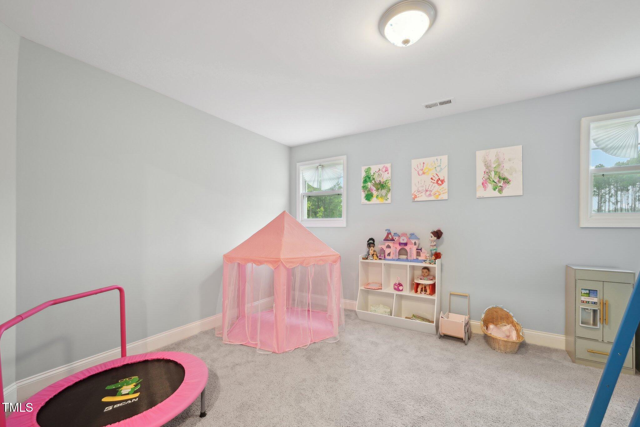 195 Solomon Drive Cameron, NC 28326 - Photo 33 of 46 a room with toys and a wooden floor