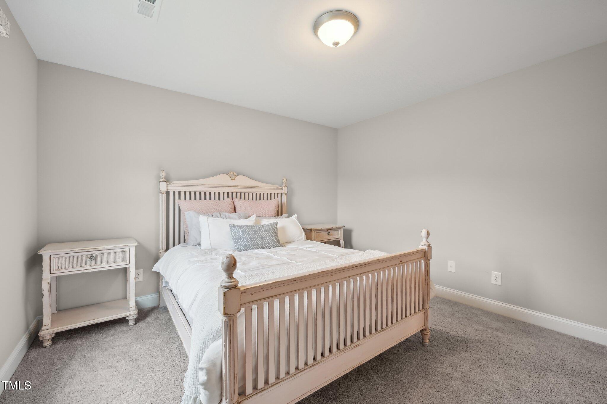 195 Solomon Drive Cameron, NC 28326 - Photo 36 of 46 a bedroom with a bed and a window