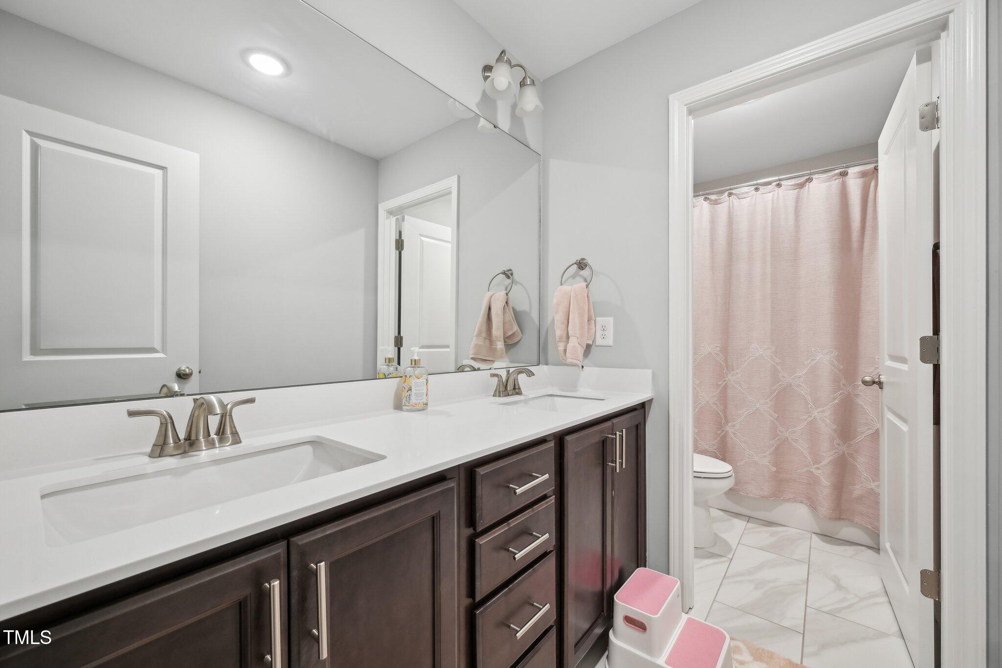195 Solomon Drive Cameron, NC 28326 - Photo 37 of 46 a bathroom with a double vanity sink mirror and double