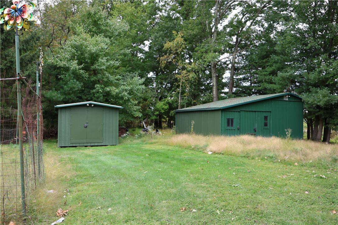 134 Bangor Junction Road Bangor, PA 18013 - Photo 16 of 18 Mature trees frame the spacious grassy property complete with useful outbuildings.