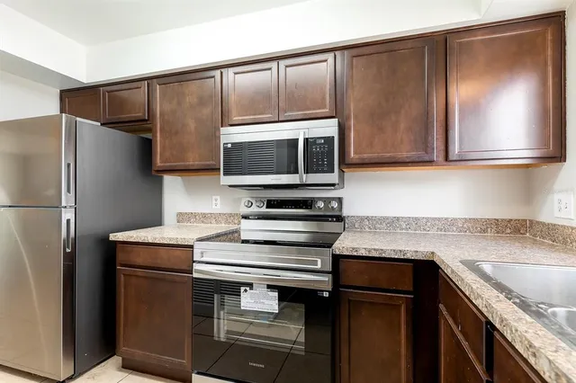 a kitchen with a sink and a microwave