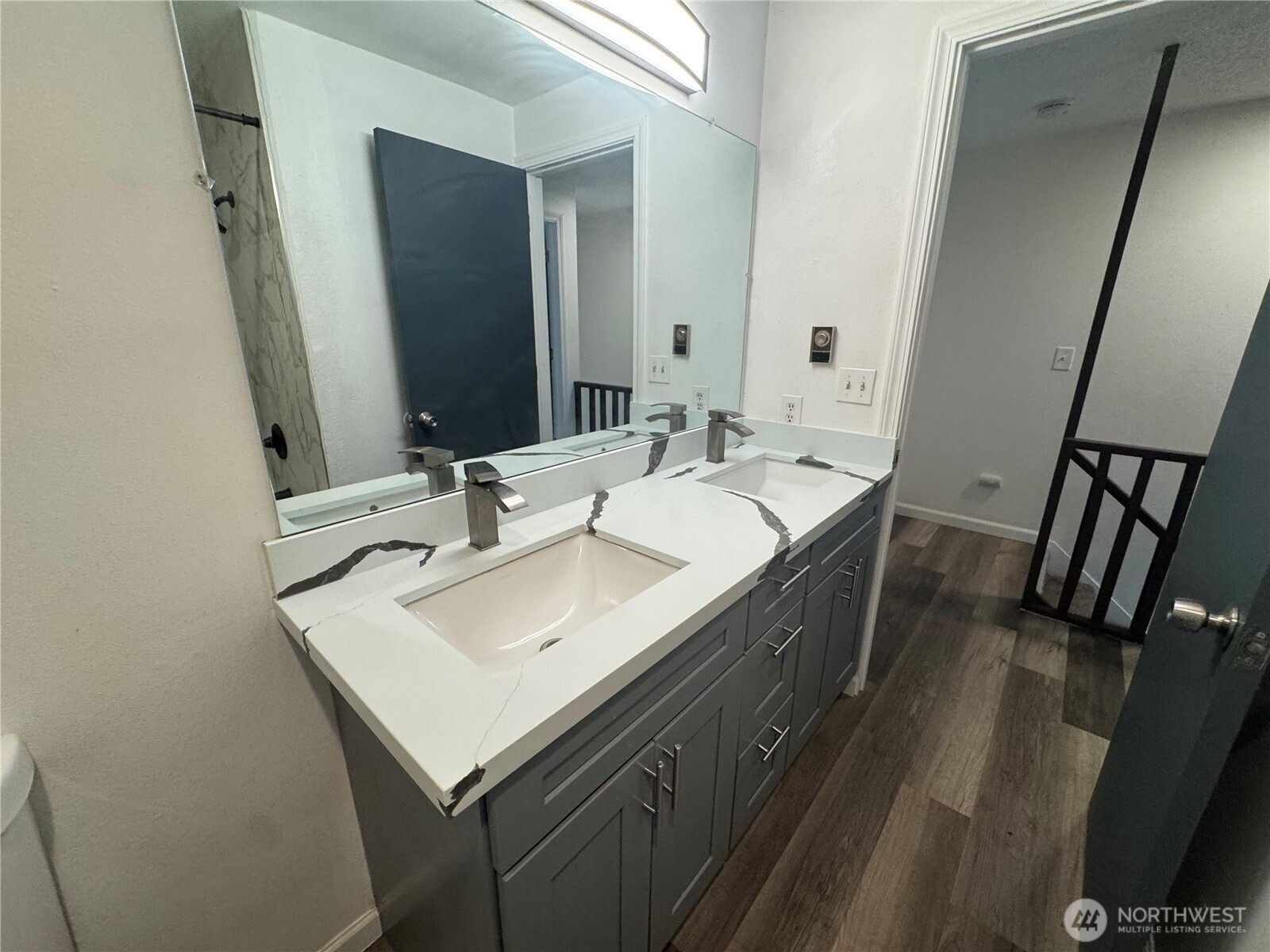 5323 Rumac Street Southeast Lacey, WA 98513 - Photo 12 of 23 a en suite bathroom with a sink and a mirror
