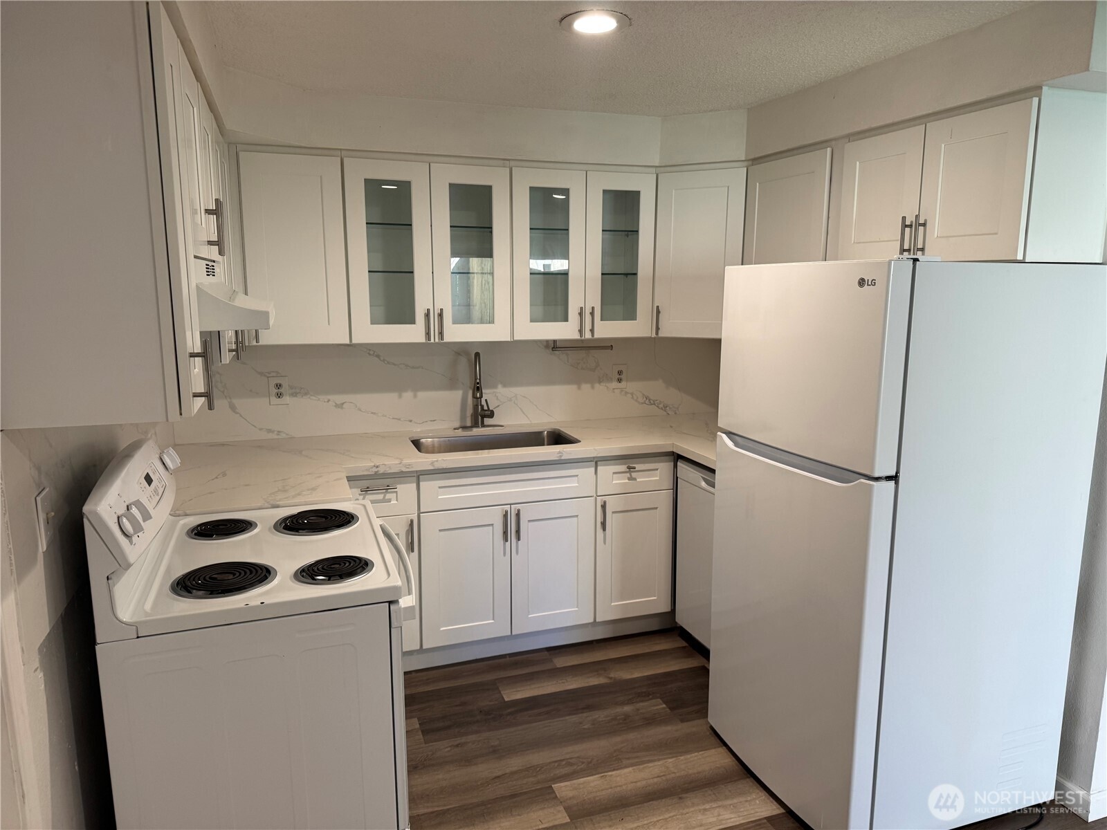 5323 Rumac Street Southeast Lacey, WA 98513 - Photo 8 of 23 a white refrigerator freezer sitting inside of a kitchen