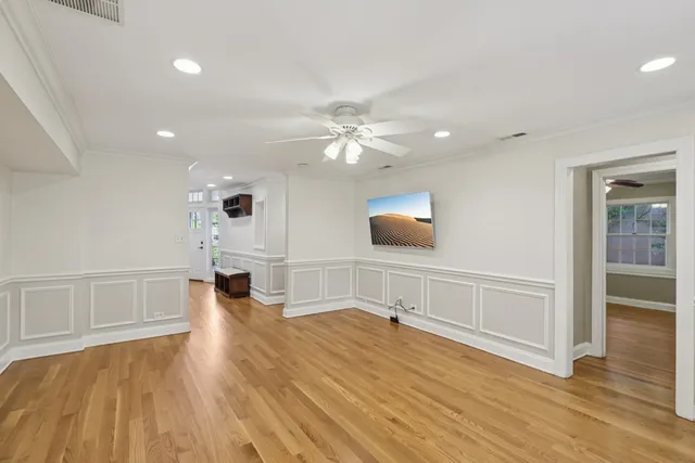 wooden floor in an empty room with a window