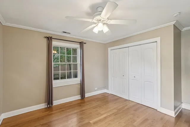 a spacious bathroom with a granite countertop tub sink shower and mirror