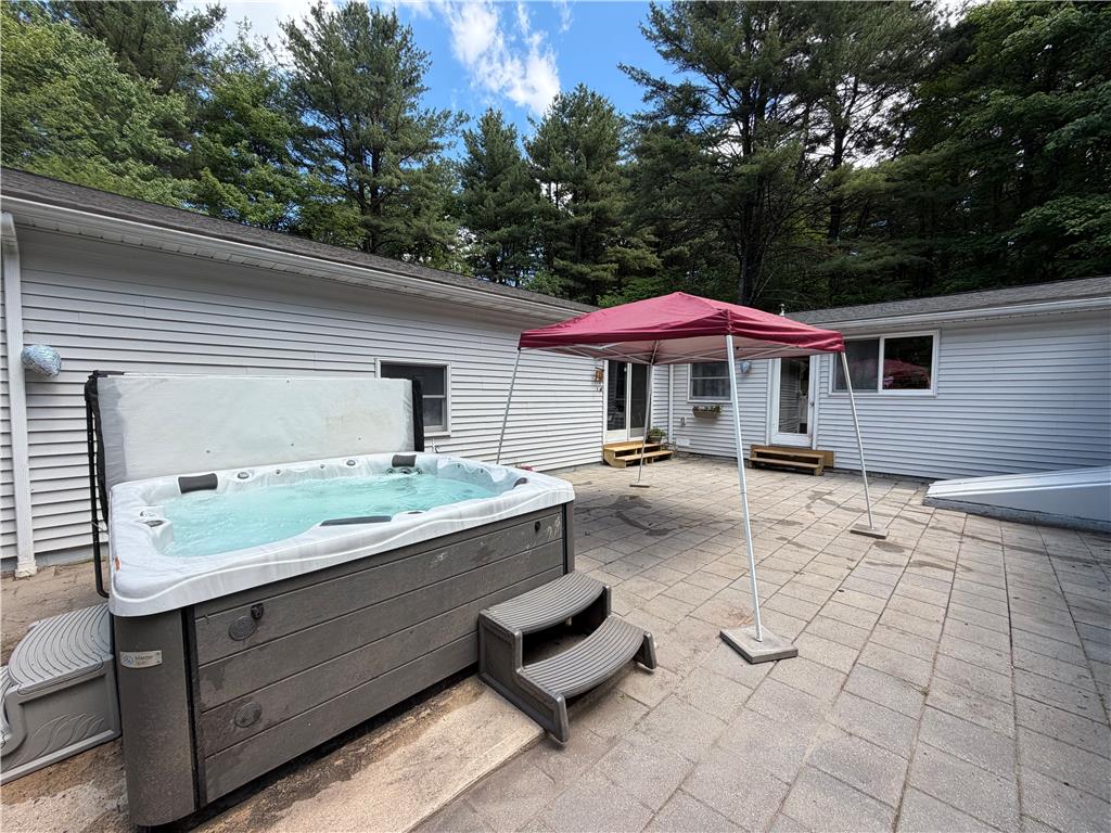 60 Sassafras Road Lehighton, PA 18235 - Photo 7 of 36 A private outdoor space with a hot tub and an inviting paved patio.