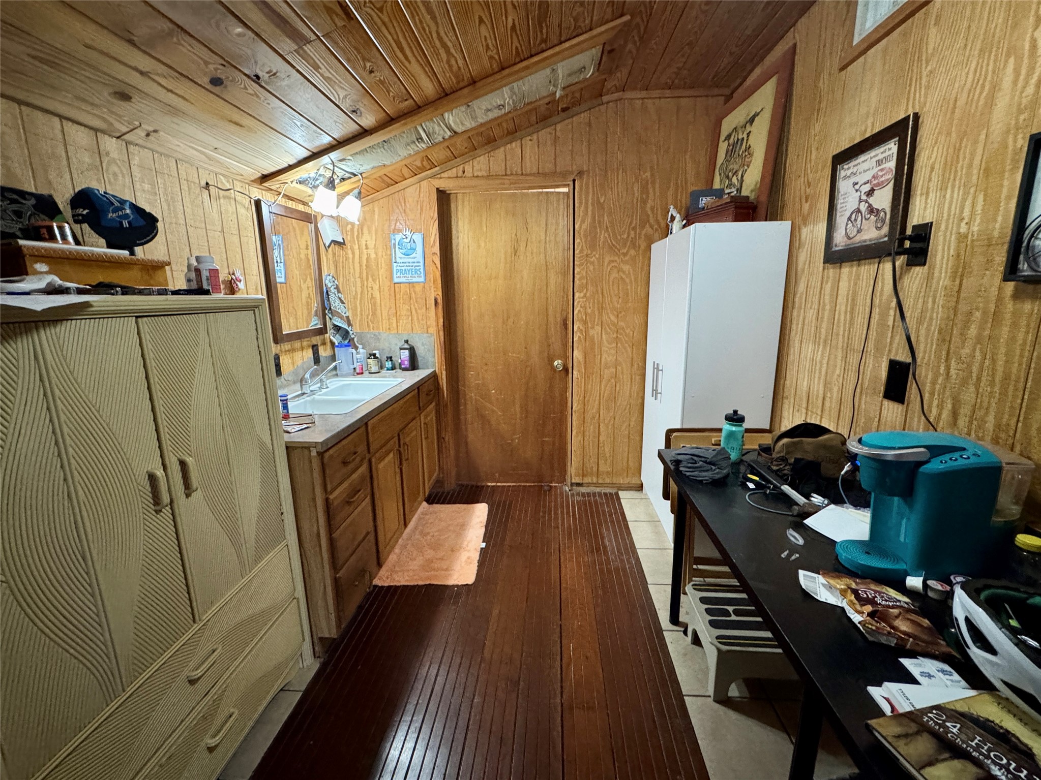 307 Deerwood Drive Trinity, TX 75862 - Photo 22 of 27 This space is being used as an upstairs kitchenette area. There are 2 bedrooms up separated by a bathroom and kitchen.