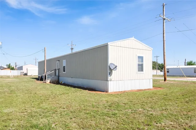 a view of a backyard of the house