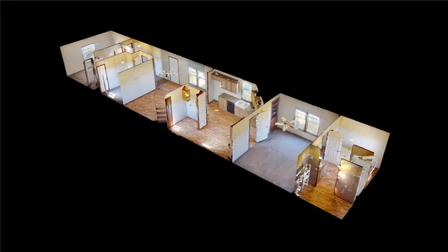 a view of a living room with furniture and floor to ceiling windows