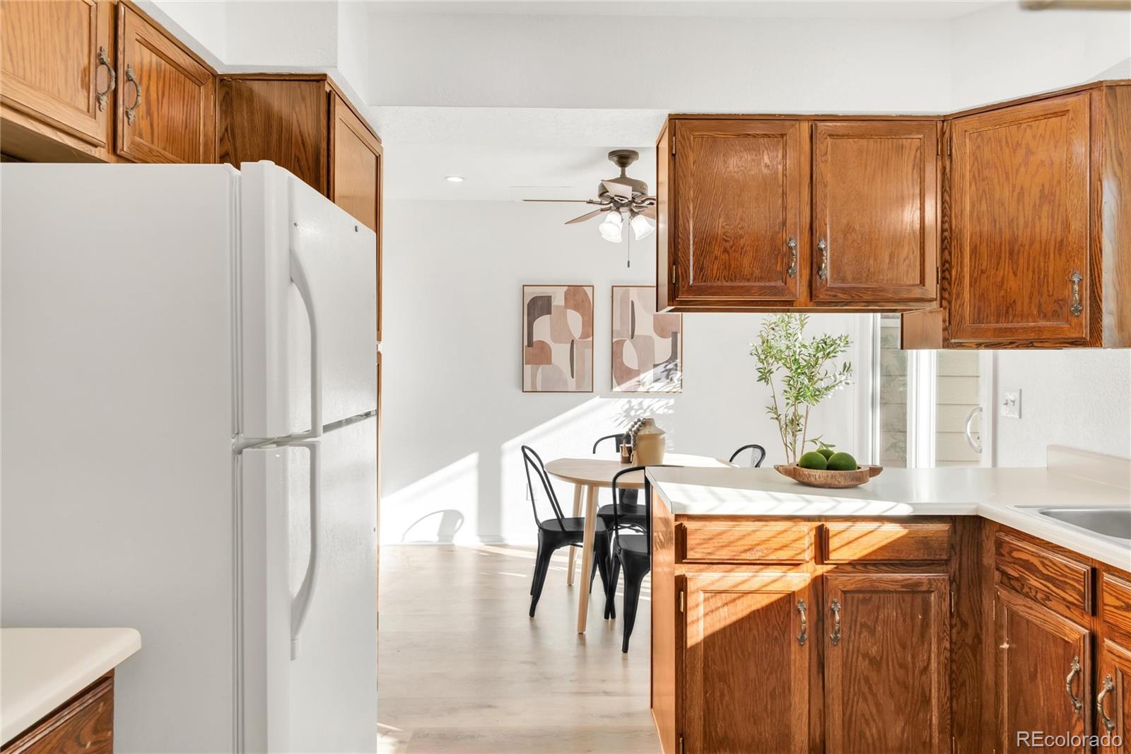 5210 Estes Circle Arvada, CO 80002 - Photo 11 of 29 a kitchen with stainless steel appliances a refrigerator and a stove