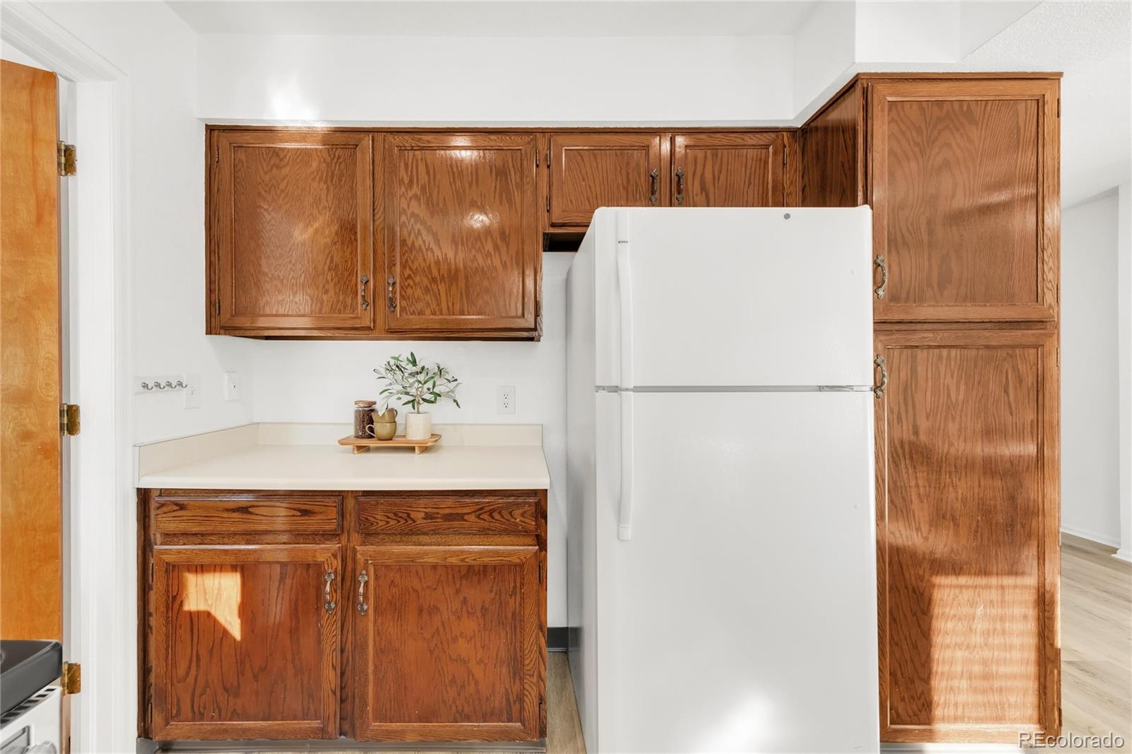 5210 Estes Circle Arvada, CO 80002 - Photo 14 of 29 a white refrigerator freezer sitting in a kitchen