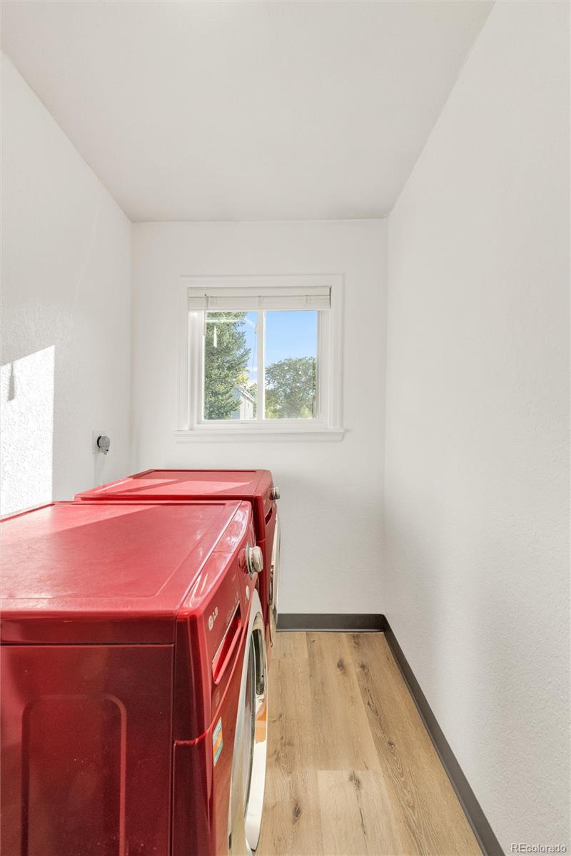 5210 Estes Circle Arvada, CO 80002 - Photo 15 of 29 a view of room with window and wooden floor