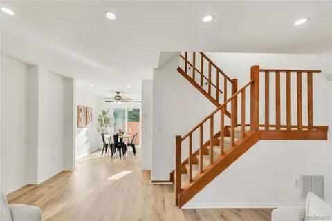 a view of entryway and hall with wooden floor