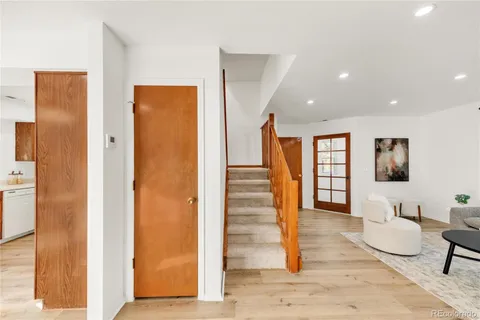 a view of entryway with wooden floor and furniture
