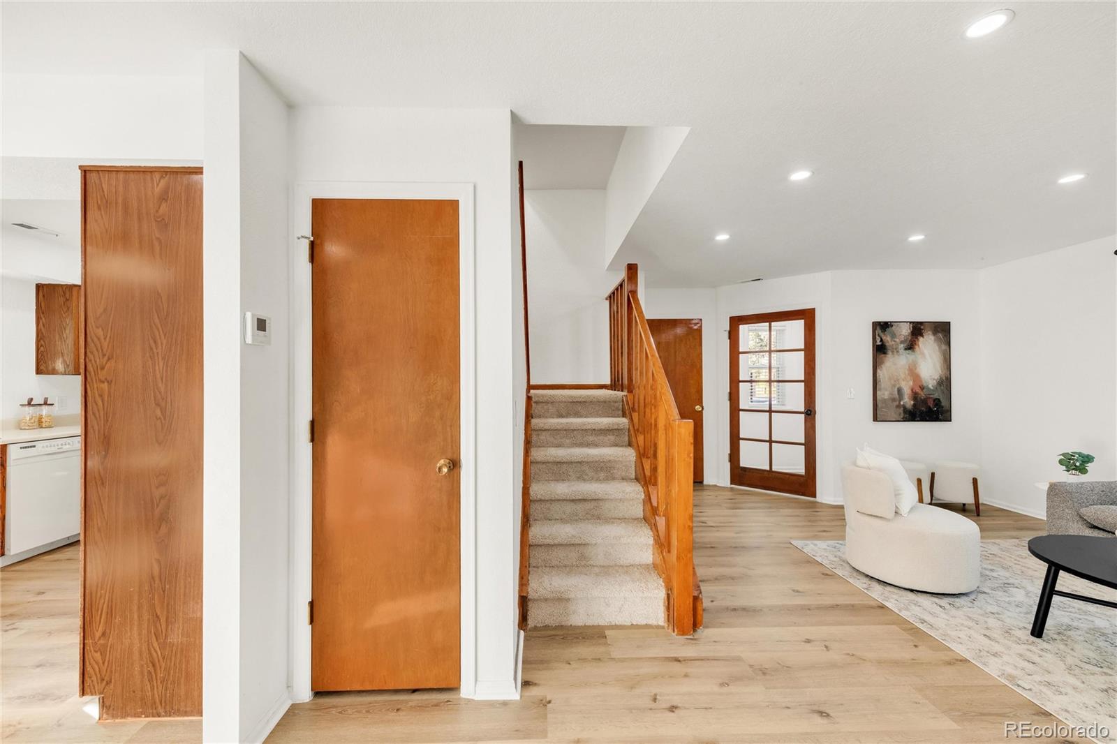 5210 Estes Circle Arvada, CO 80002 - Photo 19 of 29 a view of entryway with wooden floor and furniture