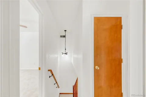 a view of a livingroom with stairs