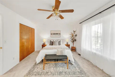 a bed room with a bed and a chandelier