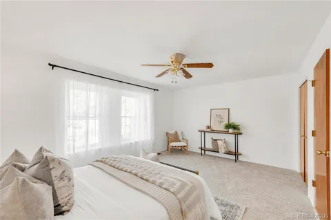 a bedroom with a bed furniture and a window