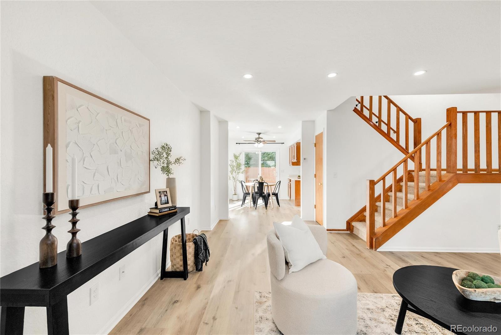 5210 Estes Circle Arvada, CO 80002 - Photo 6 of 29 a living room with furniture and wooden floor