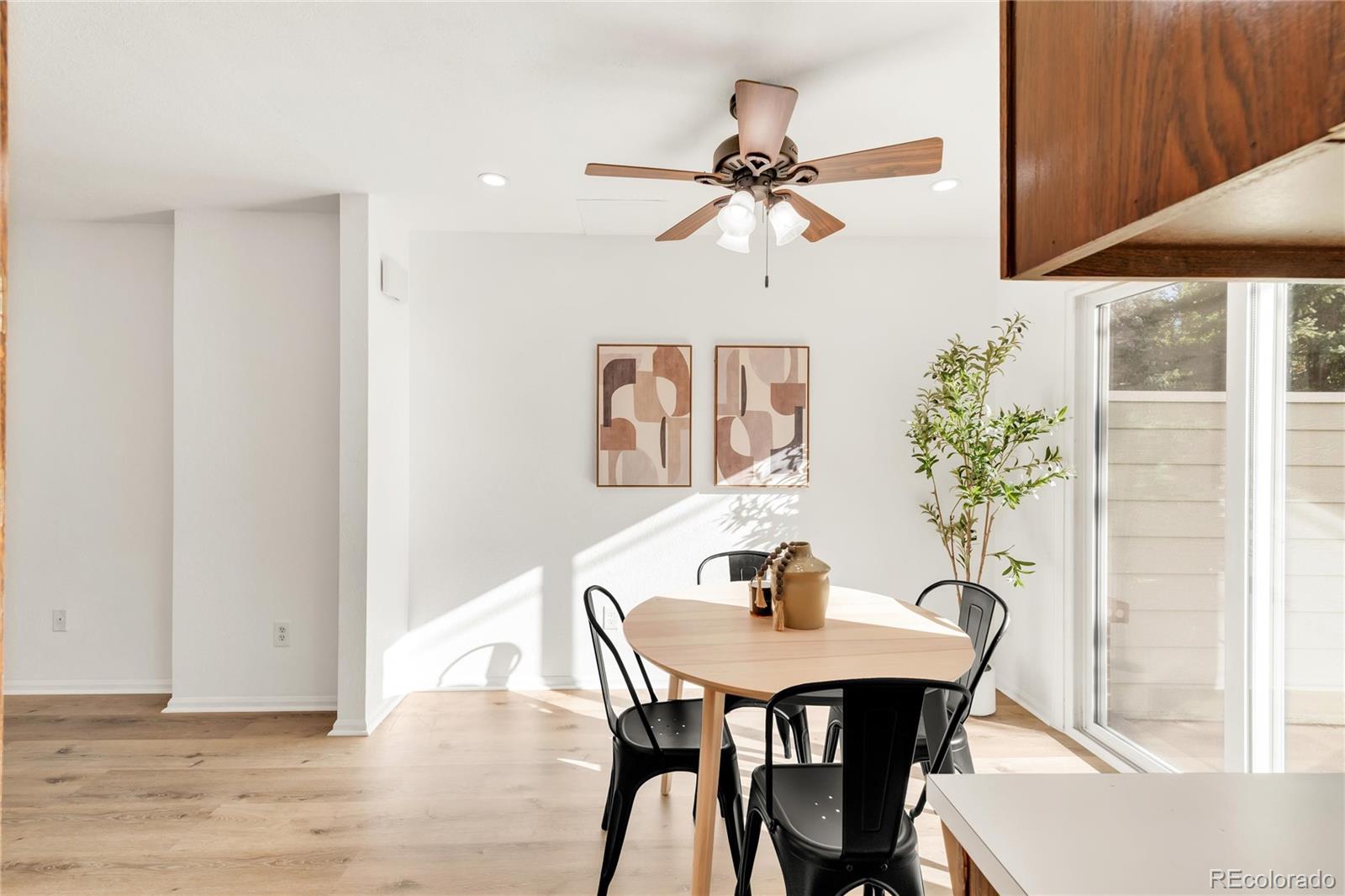 5210 Estes Circle Arvada, CO 80002 - Photo 8 of 29 a view of a dining room with furniture and wooden floor