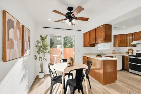 a view of a dining room with furniture window and wooden floor