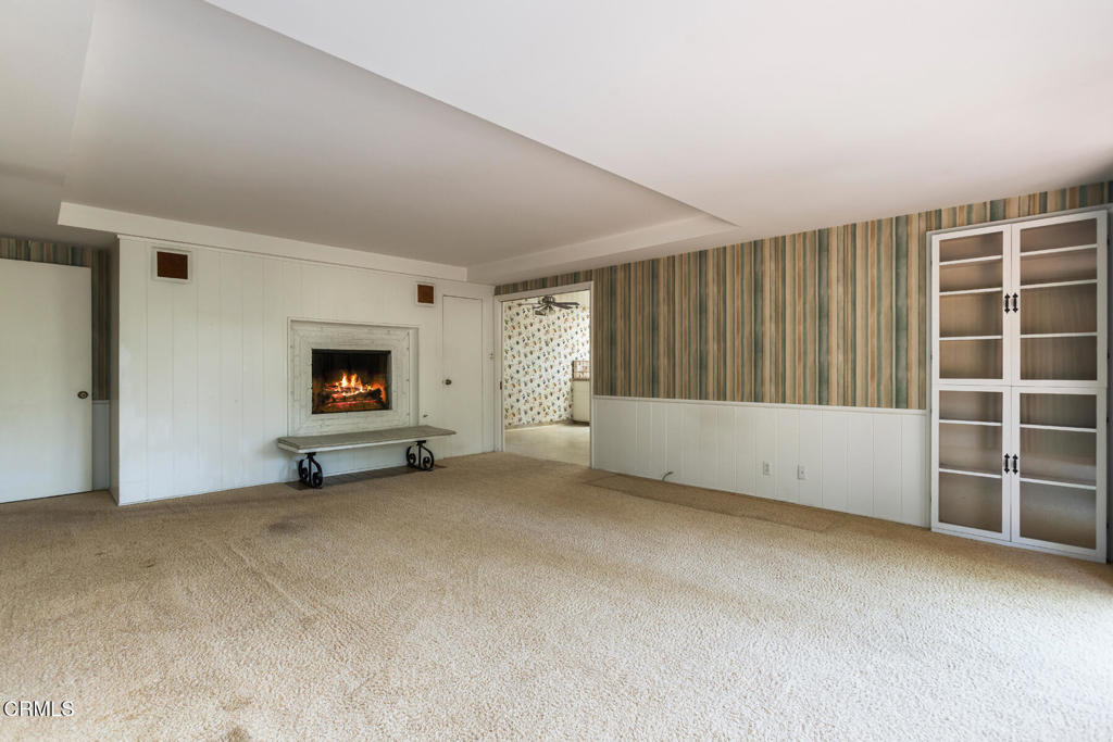 5029 Princess Anne Road La Canada Flintridge, CA 91011 - Photo 15 of 46 a view of an empty room with a fireplace and a window