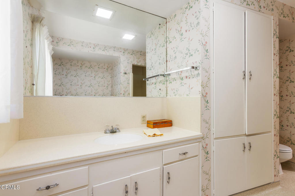 5029 Princess Anne Road La Canada Flintridge, CA 91011 - Photo 25 of 46 a bathroom with a shower sink and a mirror