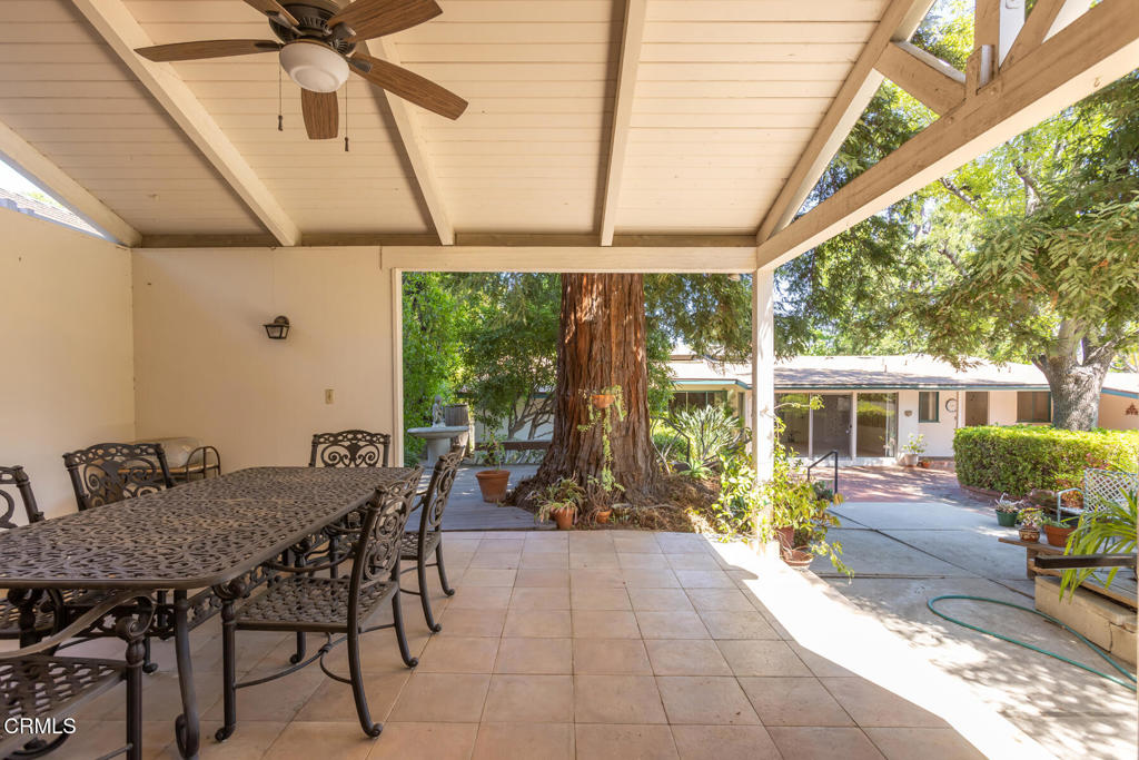 5029 Princess Anne Road La Canada Flintridge, CA 91011 - Photo 42 of 46 a dining room with furniture and a garden