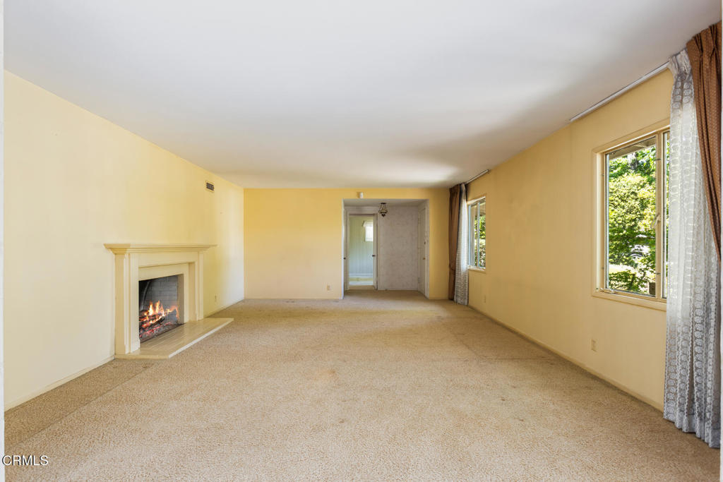 5029 Princess Anne Road La Canada Flintridge, CA 91011 - Photo 5 of 46 an empty room with windows & fireplace