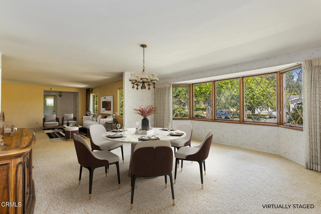 5029 Princess Anne Road La Canada Flintridge, CA 91011 - Photo 6 of 46 a view of a dining room and livingroom with furniture wooden floor a chandelier
