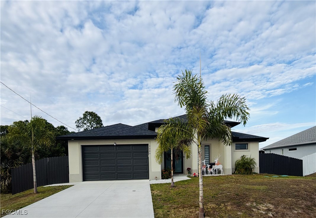 a front view of a house with a garage