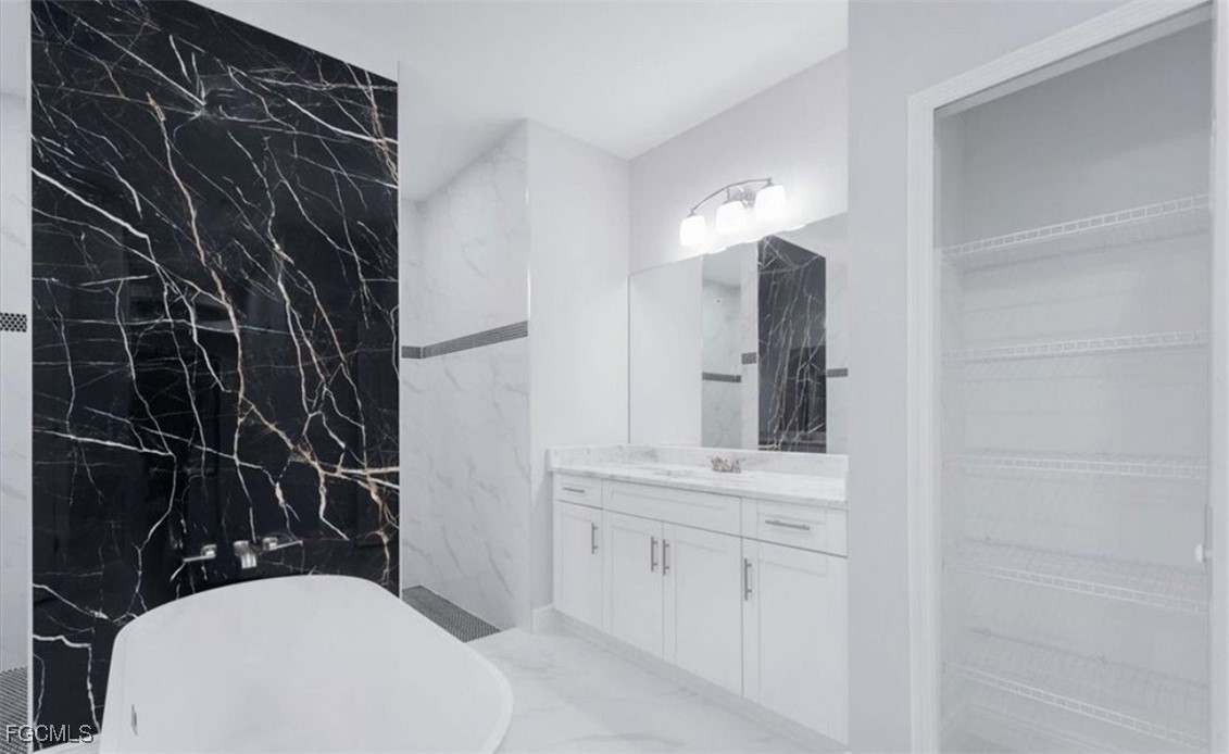 3208 3rd Street Southwest Lehigh Acres, FL 33976 - Photo 23 of 31 a bathroom with a sink toilet and shower