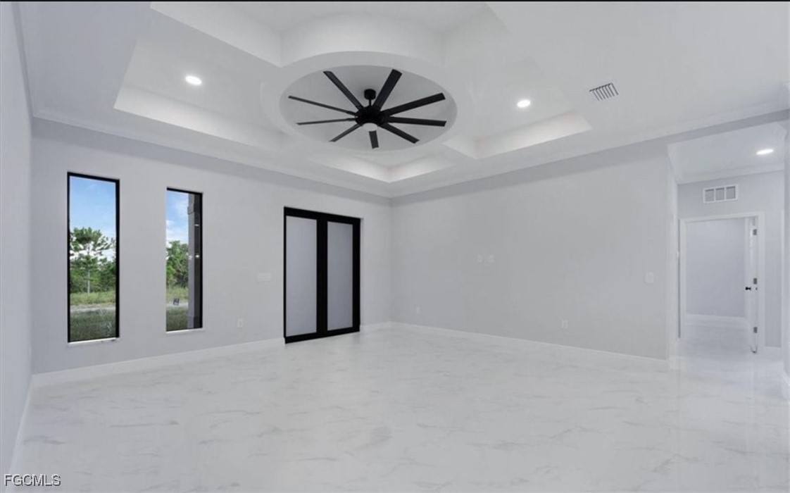 3208 3rd Street Southwest Lehigh Acres, FL 33976 - Photo 29 of 31 a view of a livingroom with a ceiling fan and window