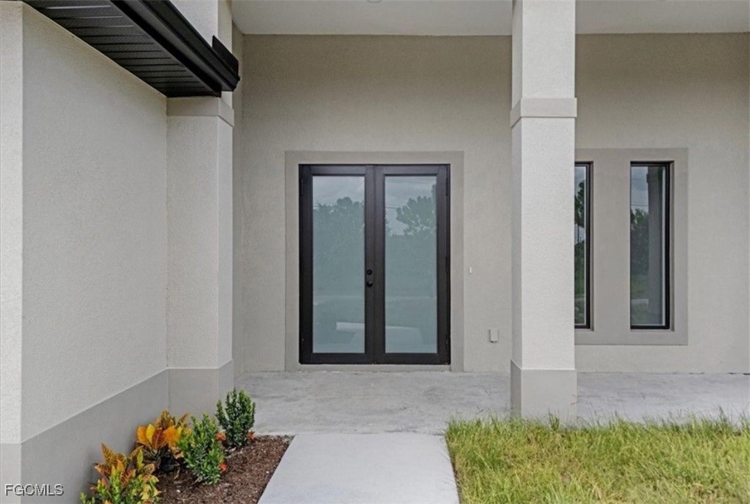 3208 3rd Street Southwest Lehigh Acres, FL 33976 - Photo 4 of 31 a front view of a house