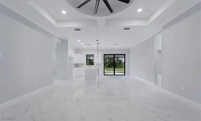 a view of an empty room with windows