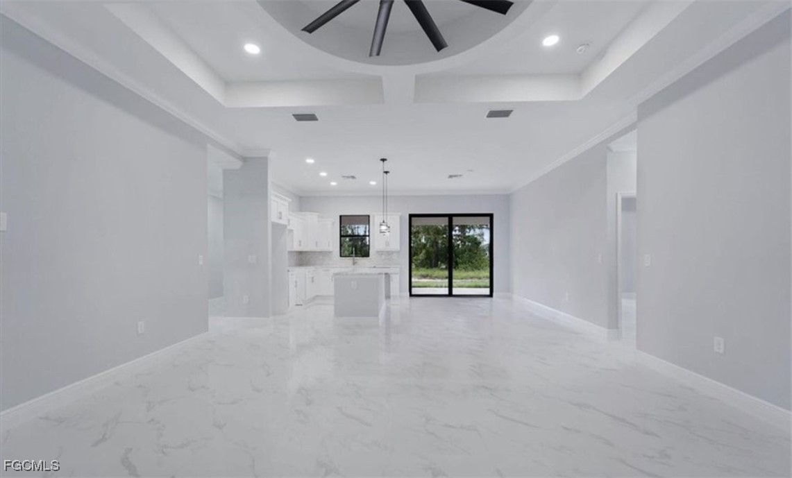 3208 3rd Street Southwest Lehigh Acres, FL 33976 - Photo 5 of 31 a view of an empty room with windows