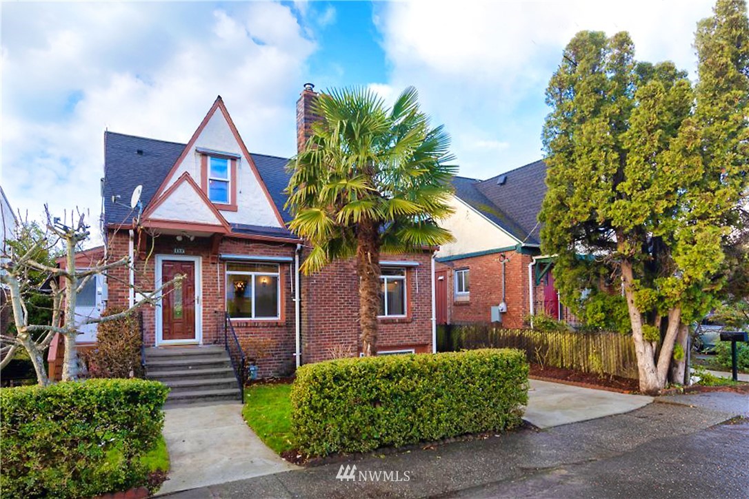 1433 South Hinds Street Seattle, WA 98144 - Photo 1 of 40 a front view of a house with garden