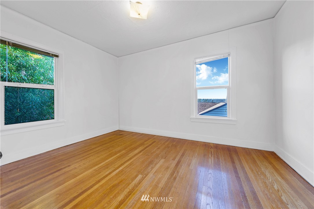 1433 South Hinds Street Seattle, WA 98144 - Photo 12 of 40 a view of empty room with wooden floor and fan