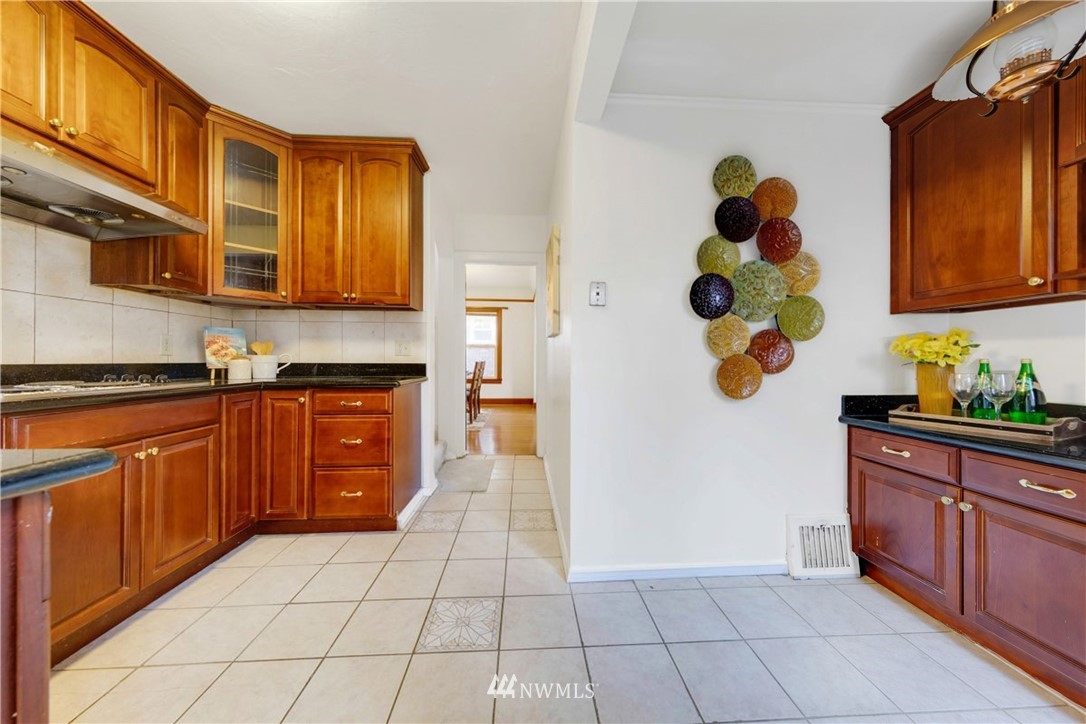 1433 South Hinds Street Seattle, WA 98144 - Photo 15 of 40 a kitchen with a cabinets and appliances
