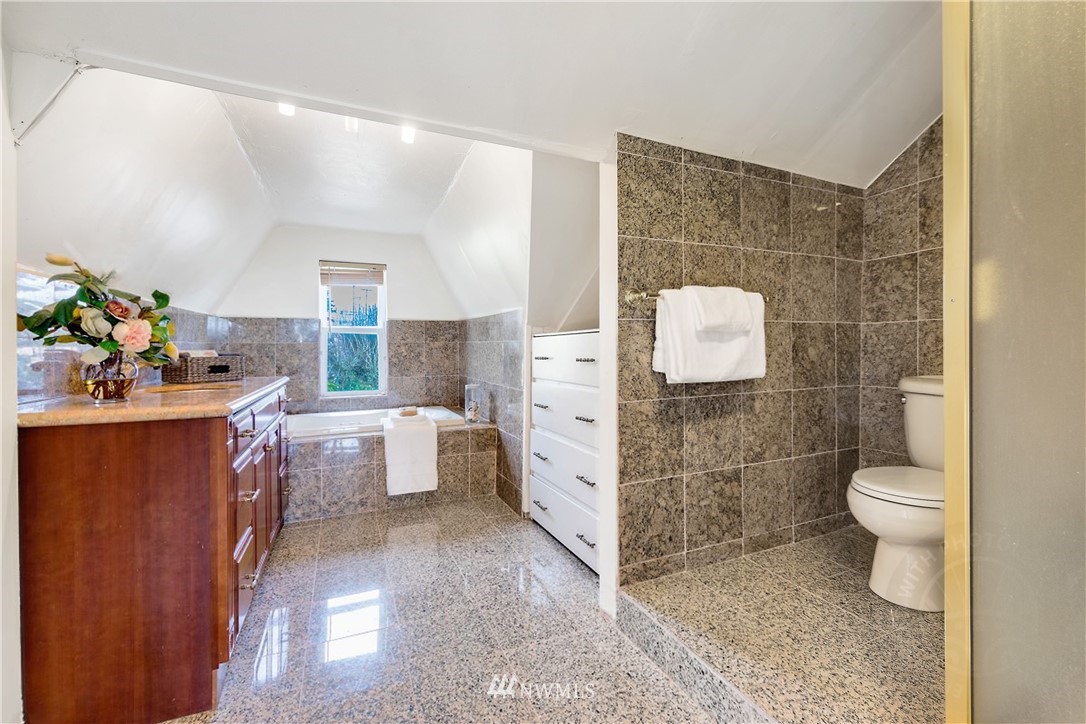 1433 South Hinds Street Seattle, WA 98144 - Photo 25 of 40 a bathroom with a sink toilet and shower