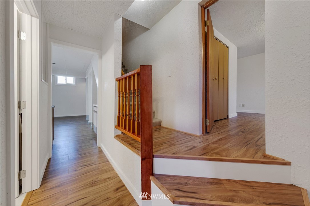 1433 South Hinds Street Seattle, WA 98144 - Photo 28 of 40 a view of a hallway with wooden floor and staircase