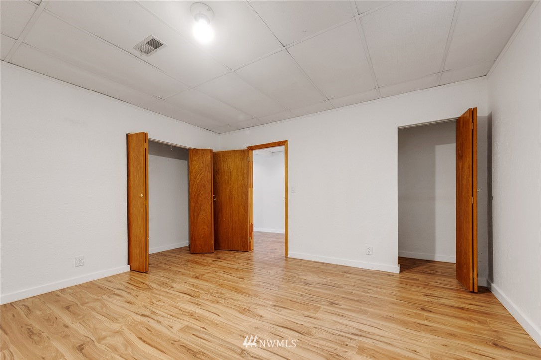 1433 South Hinds Street Seattle, WA 98144 - Photo 30 of 40 a view of an empty room with wooden floor