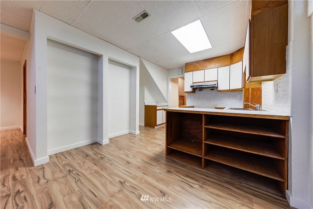 1433 South Hinds Street Seattle, WA 98144 - Photo 35 of 40 a view of kitchen with cabinets and wooden floor